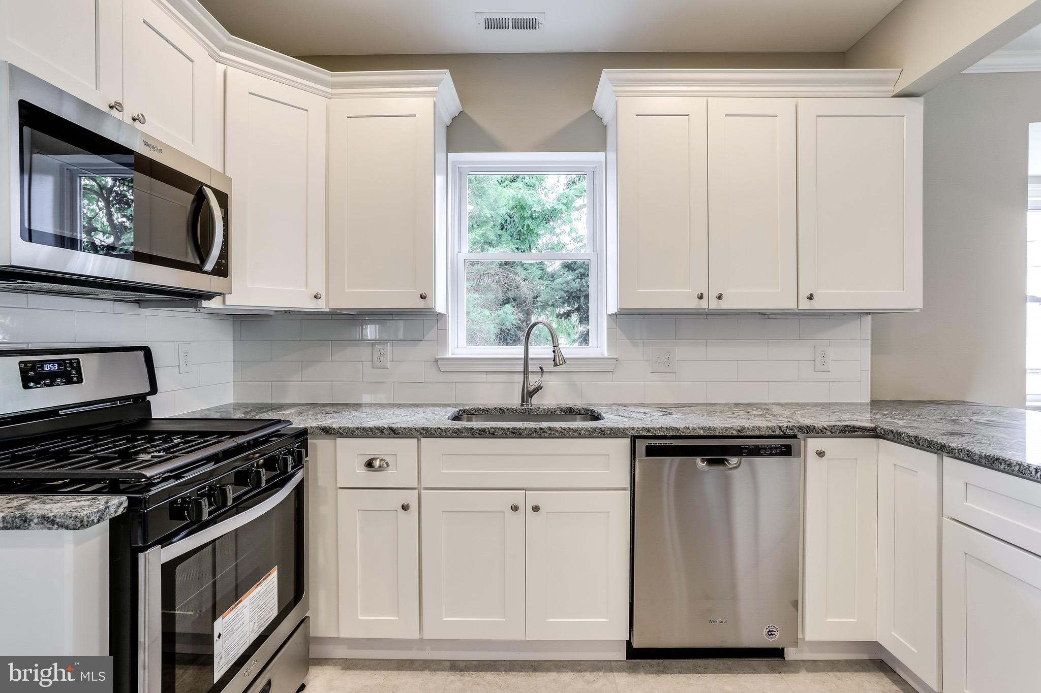 3505 St James Road Baltimore, MD 21244 - Photo 12 of 32 Soft close cabinets, tile floor & granite