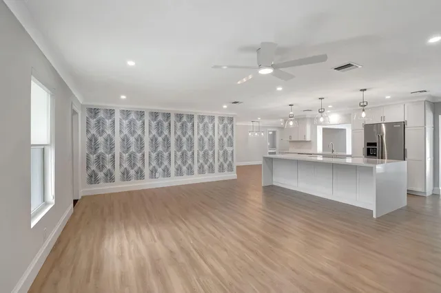 a view of kitchen and wooden floor