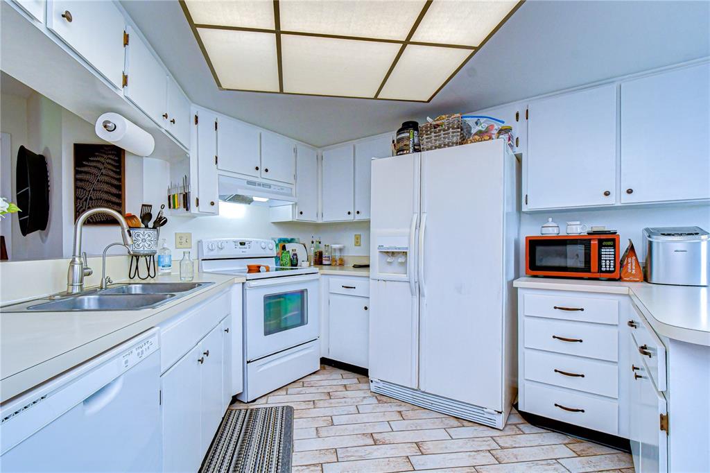 3439 Teeside Drive New Port Richey, FL 34655 - Photo 16 of 85 a kitchen with cabinets appliances and a counter space