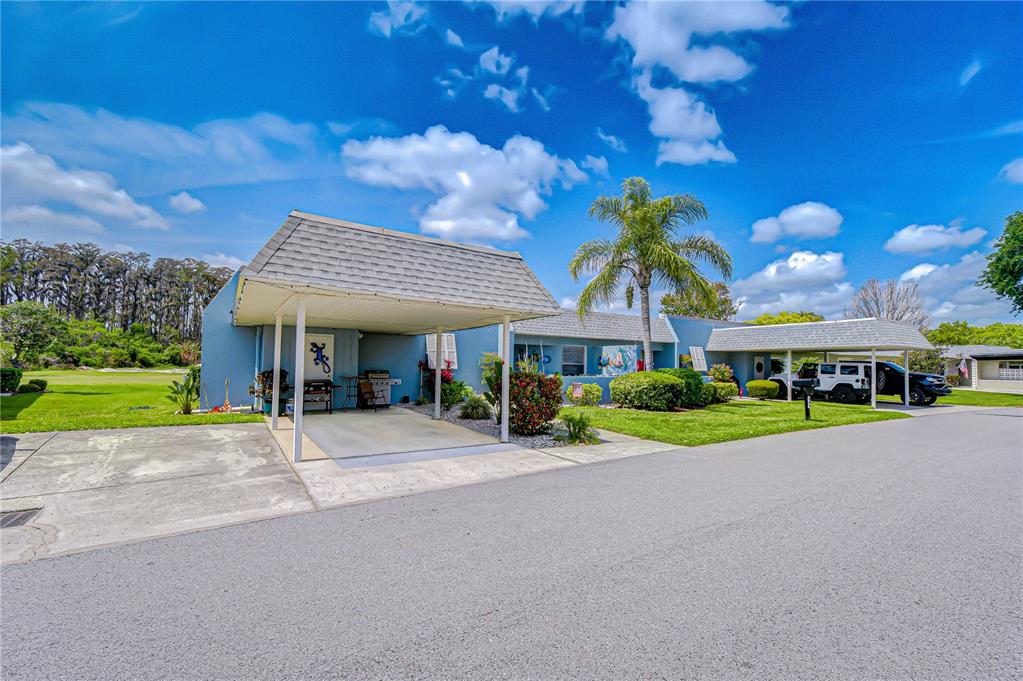 3439 Teeside Drive New Port Richey, FL 34655 - Photo 2 of 85 a view of a house with a yard and potted plants