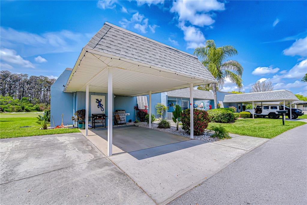 3439 Teeside Drive New Port Richey, FL 34655 - Photo 3 of 85 a view of a house with a yard and potted plants