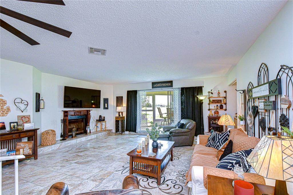 3439 Teeside Drive New Port Richey, FL 34655 - Photo 32 of 85 a living room with furniture and a flat screen tv