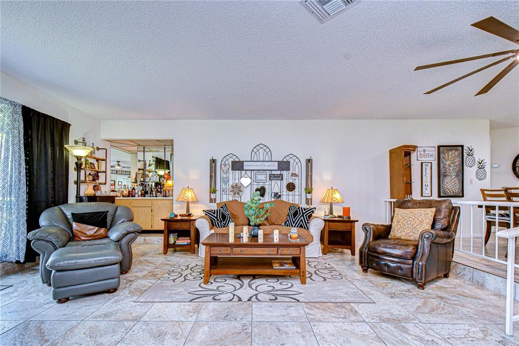 3439 Teeside Drive New Port Richey, FL 34655 - Photo 33 of 85 a living room with furniture and a table