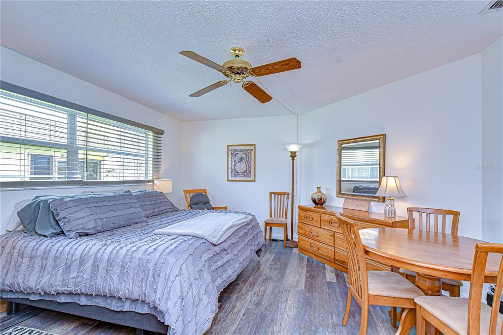 3439 Teeside Drive New Port Richey, FL 34655 - Photo 45 of 85 a bedroom with a bed and wooden floor