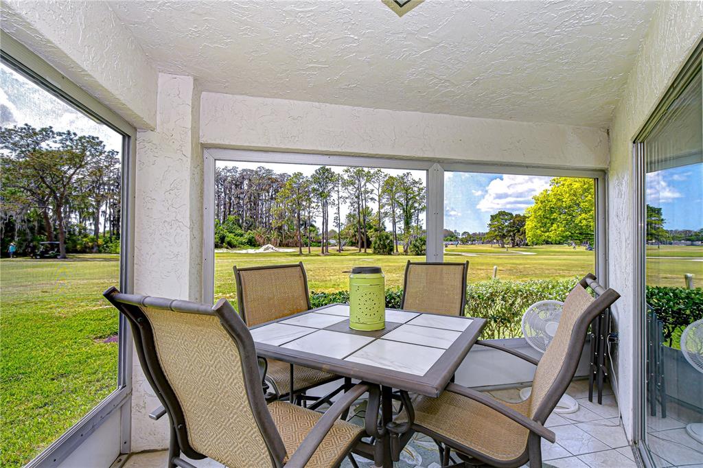 3439 Teeside Drive New Port Richey, FL 34655 - Photo 54 of 85 a view of a porch with furniture and garden