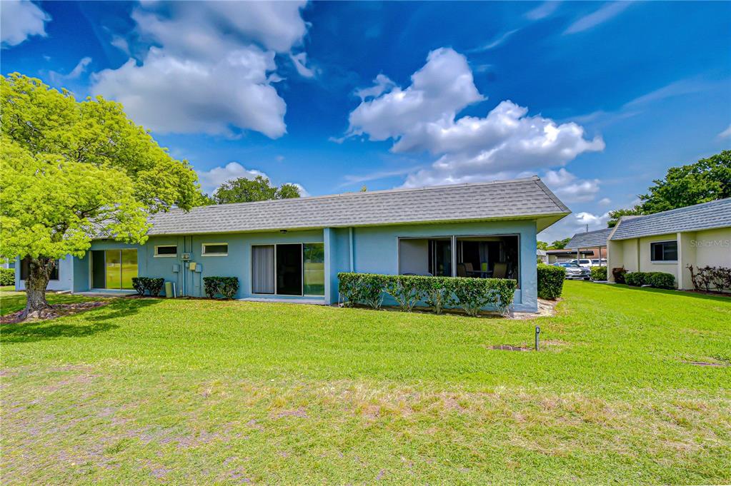 3439 Teeside Drive New Port Richey, FL 34655 - Photo 56 of 85 a view of a house with a yard and front tree