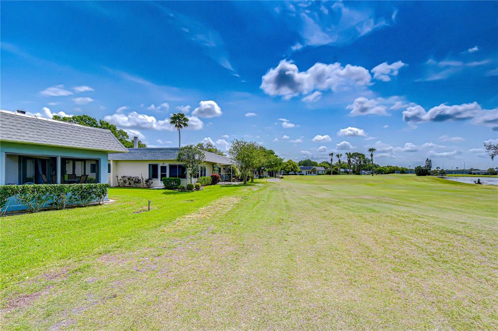 3439 Teeside Drive New Port Richey, FL 34655 - Photo 57 of 85 a front view of house with yard and outdoor seating