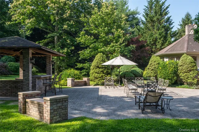 a view of a chairs and table under an umbrella