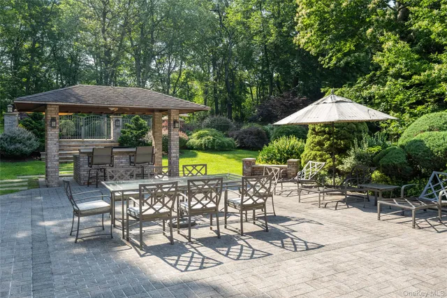 a view of a backyard with a patio