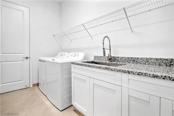 a bathroom with a sink and vanity