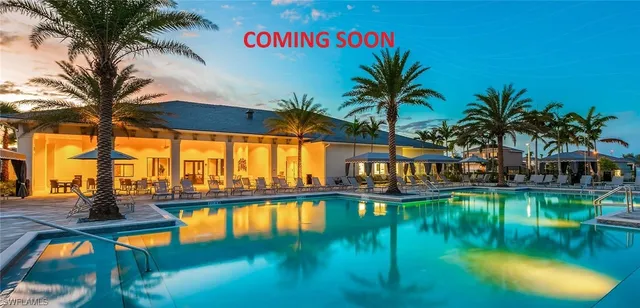 a view of swimming pool with a table and chairs