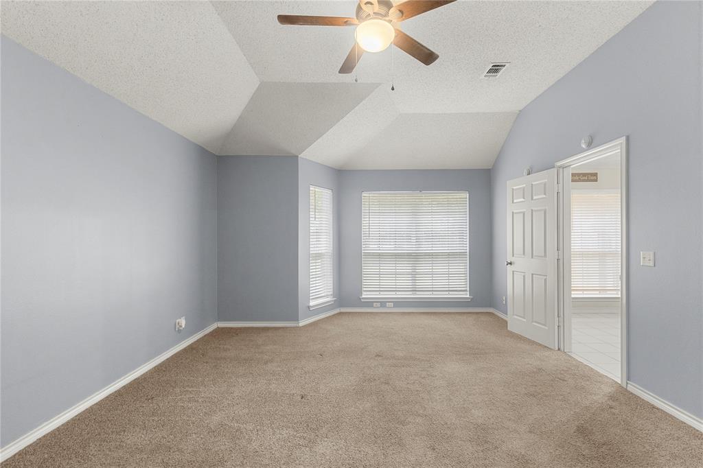 2917 Harlow Road Commerce, TX 75428 - Photo 17 of 40 wooden floor in an empty room with a window