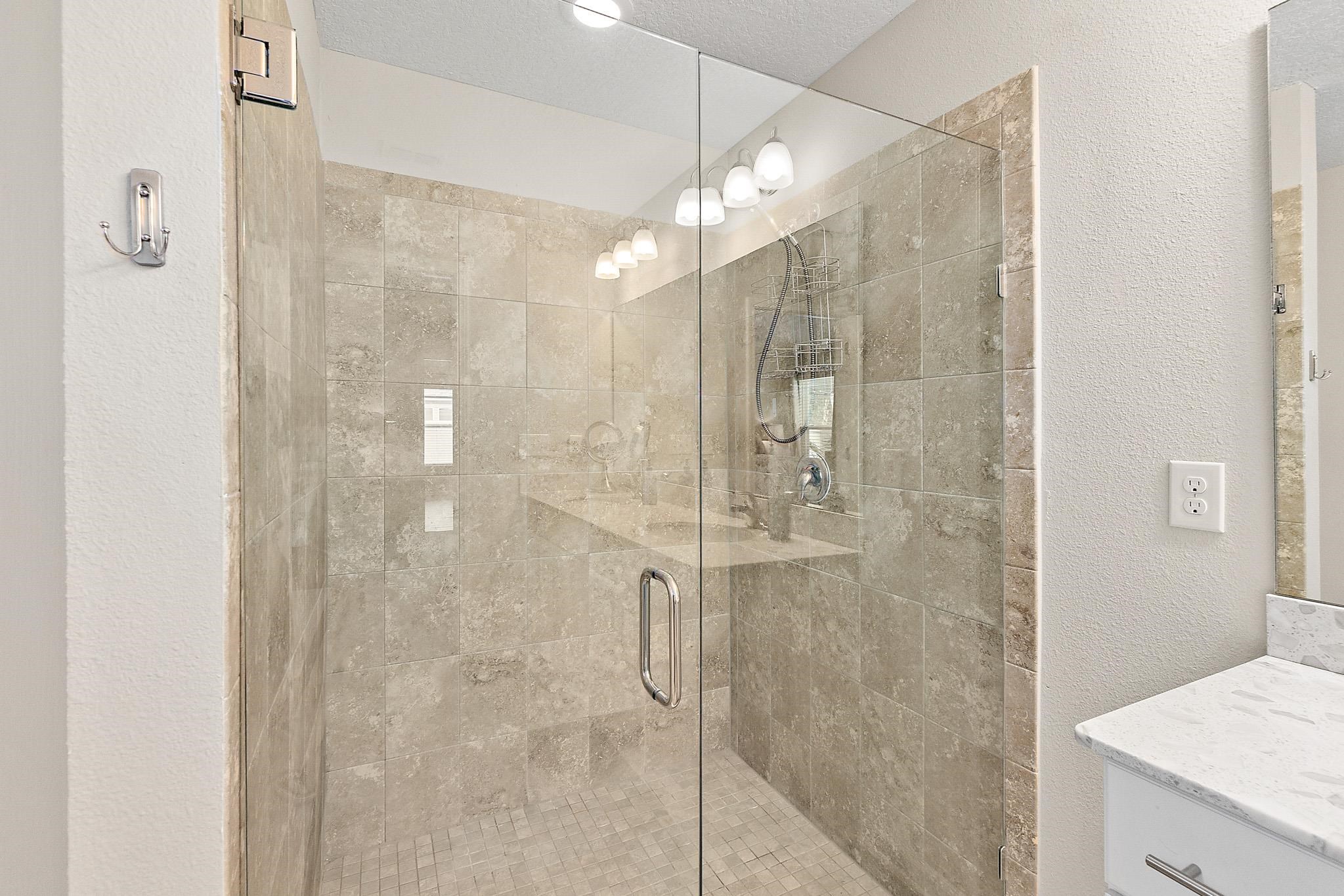 602 Crescent Key Drive St. Augustine, FL 32086 - Photo 19 of 47 a bathroom with a shower and a sink