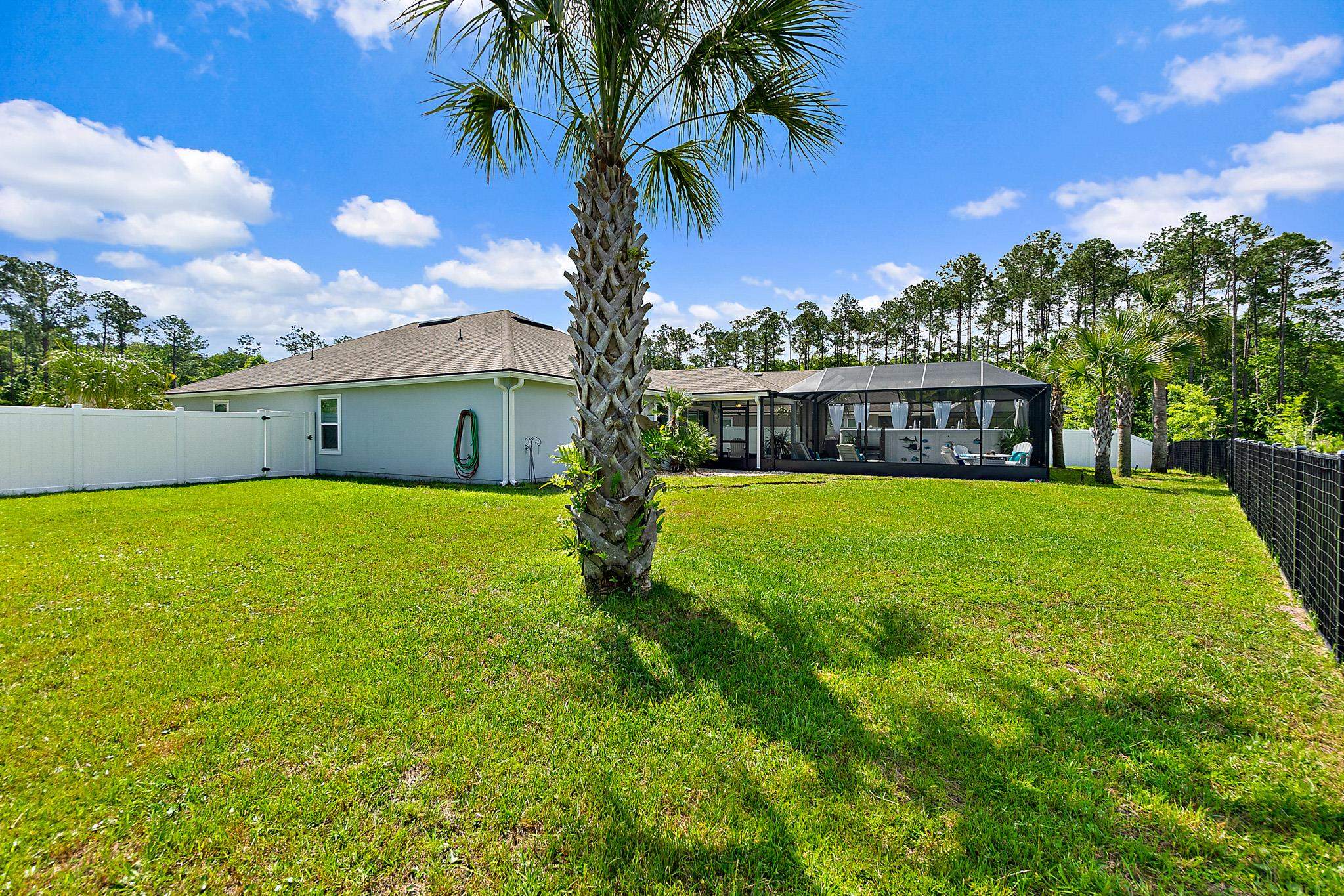 602 Crescent Key Drive St. Augustine, FL 32086 - Photo 35 of 47 a view of a house with a swimming pool