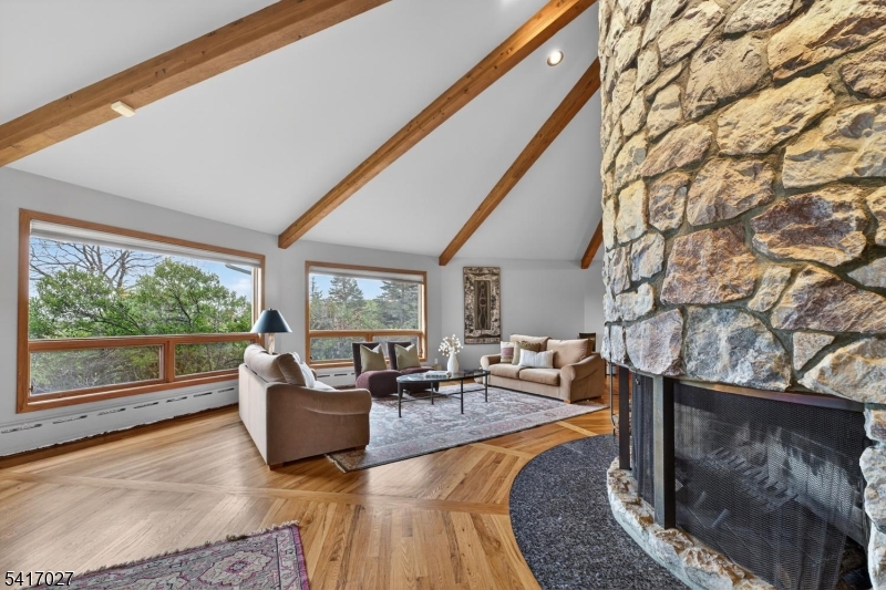 166 River Road Annandale, NJ 08801 - Photo 15 of 37 a living room with furniture and a floor to ceiling window