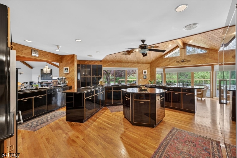 166 River Road Annandale, NJ 08801 - Photo 18 of 37 a kitchen with stainless steel appliances granite countertop a stove a sink and a refrigerator