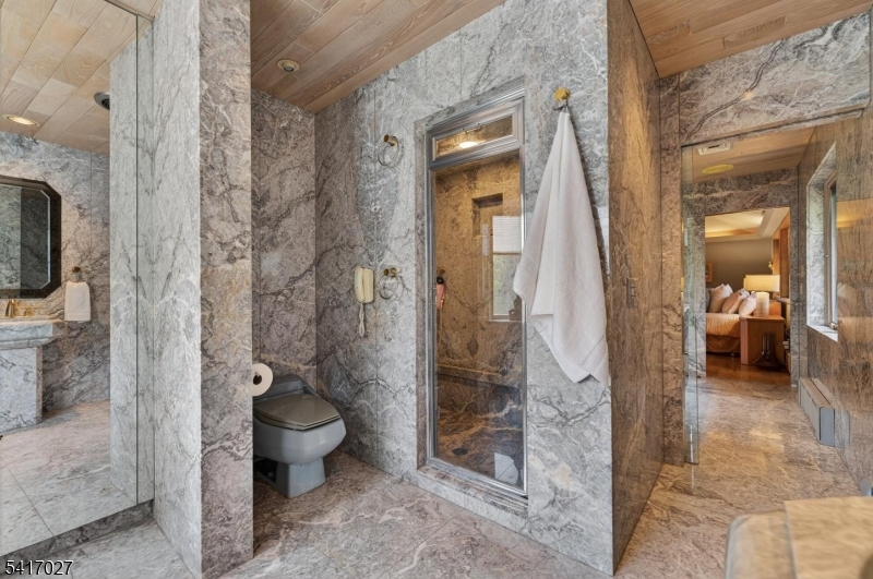 166 River Road Annandale, NJ 08801 - Photo 28 of 37 a bathroom with a granite countertop toilet a mirror and shower