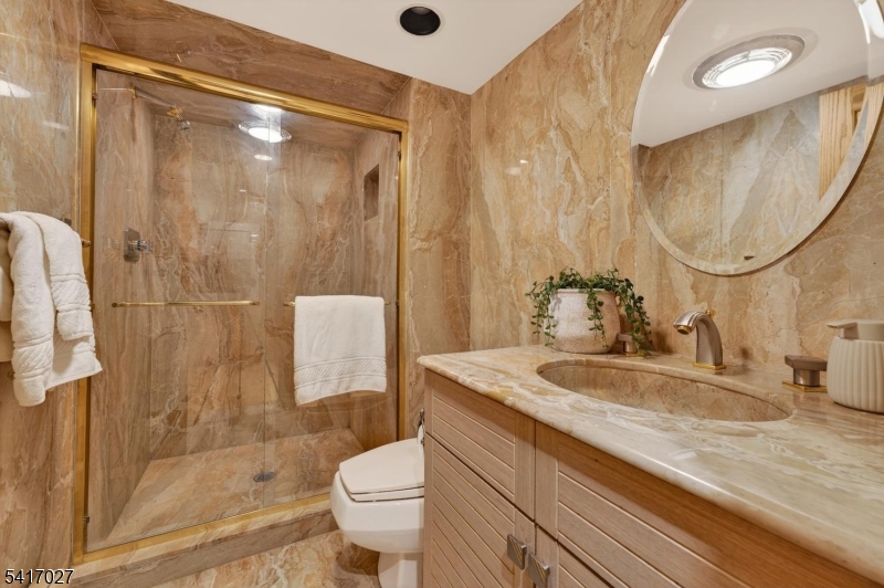 166 River Road Annandale, NJ 08801 - Photo 30 of 37 a bathroom with a sink a toilet and shower