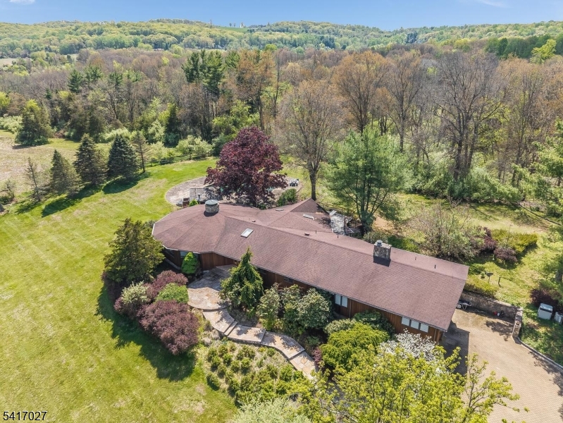 166 River Road Annandale, NJ 08801 - Photo 3 of 37 an aerial view of a house with garden