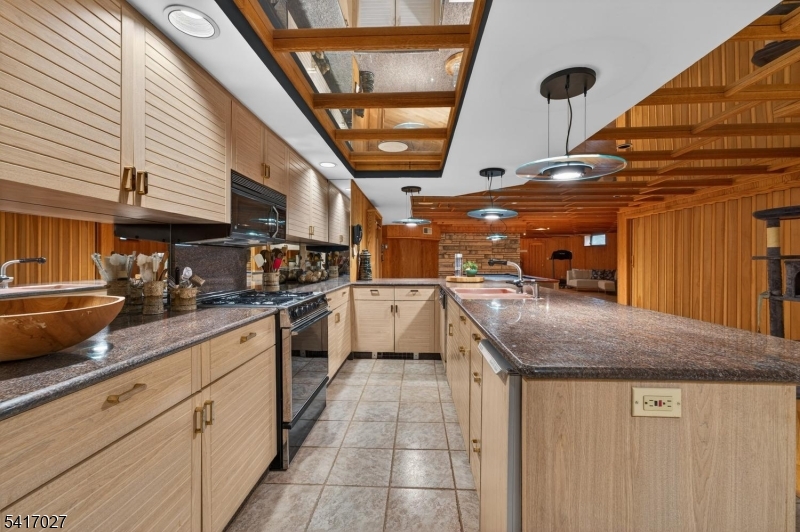 166 River Road Annandale, NJ 08801 - Photo 36 of 37 a kitchen with stainless steel appliances granite countertop a sink and white cabinets