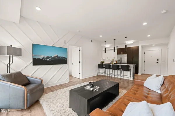 a living room with furniture and a table