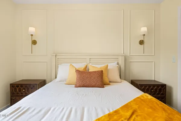 a bedroom with a bed and cabinets