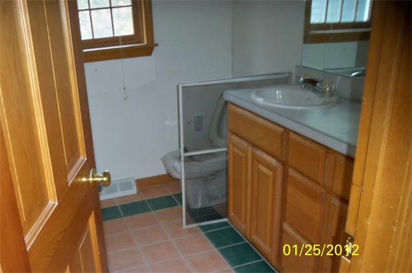 17 Kelshill Road Chelmsford, MA 01863 - Photo 5 of 7 a bathroom with a sink and a mirror