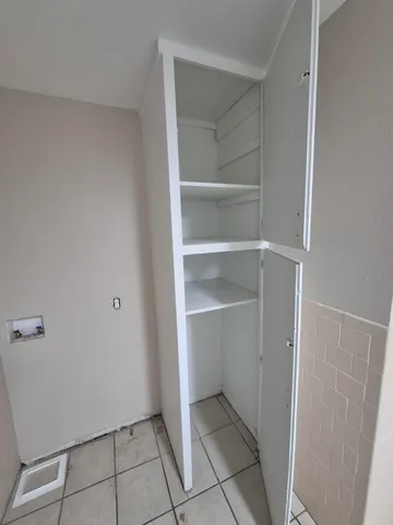 a view of an empty walk in closet