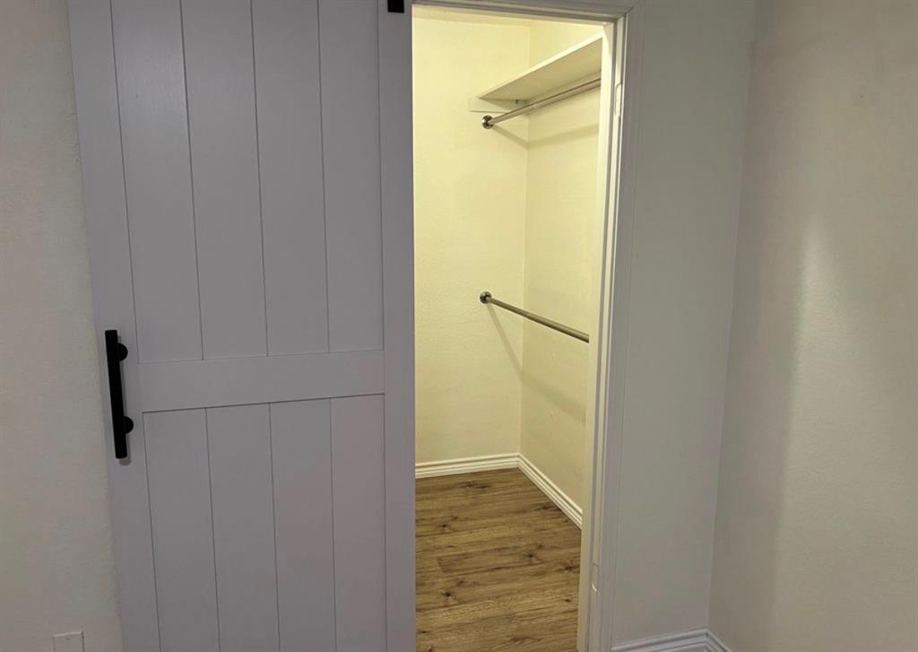 8 Trails Place, Unit B Wylie, TX 75098 - Photo 14 of 24 a view of walk in closet