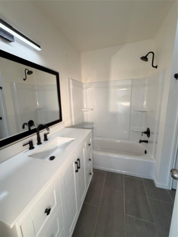 8 Trails Place, Unit B Wylie, TX 75098 - Photo 15 of 24 a bathroom with a tub sink and mirror