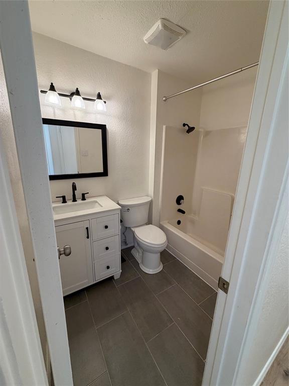 8 Trails Place, Unit B Wylie, TX 75098 - Photo 18 of 24 a bathroom with a toilet sink and mirror