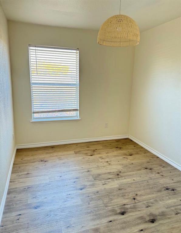 8 Trails Place, Unit B Wylie, TX 75098 - Photo 20 of 24 a view of empty room with wooden floor and fan