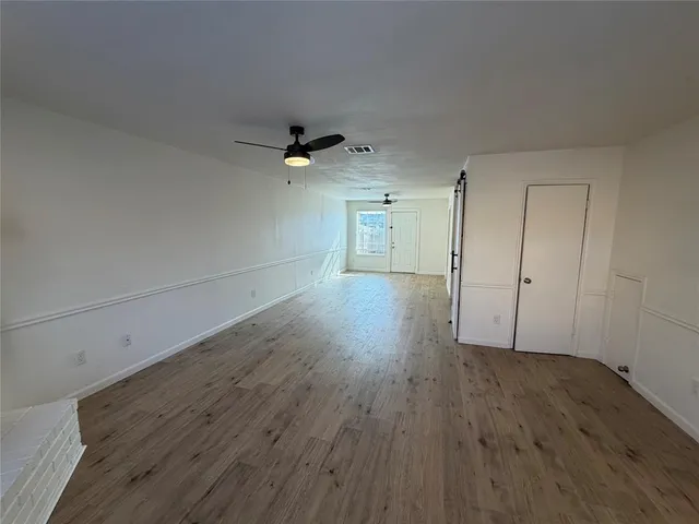 a view of a livingroom with wooden floor