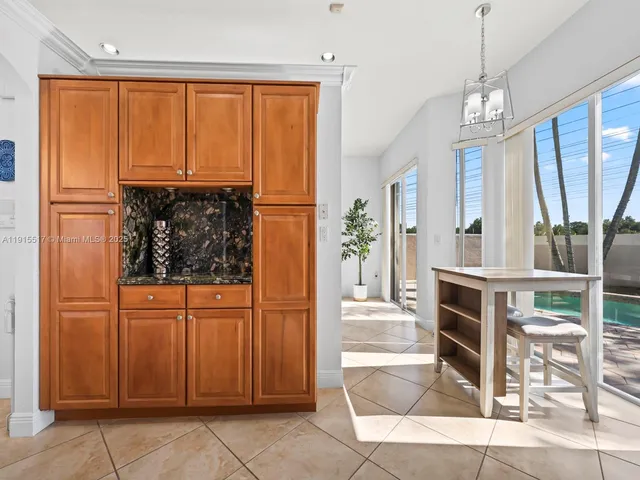 a bedroom with a bed and a television