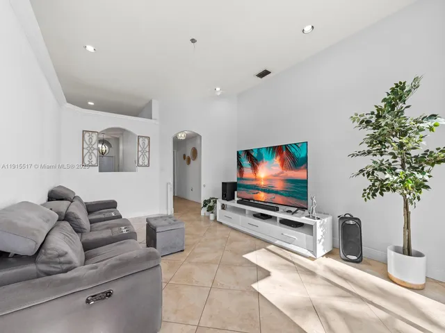 a view of walk in closet with clothes