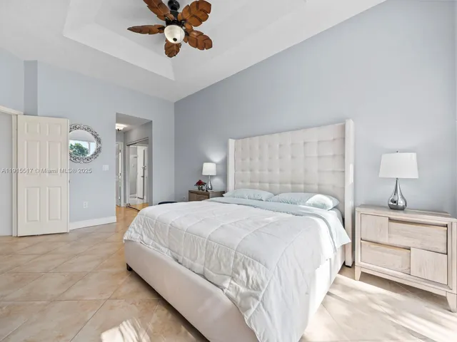 a white toilet sitting next to a white wall