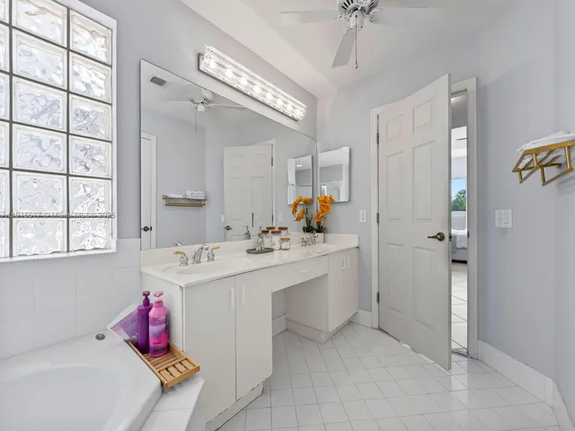 a front view of a house with garden and patio