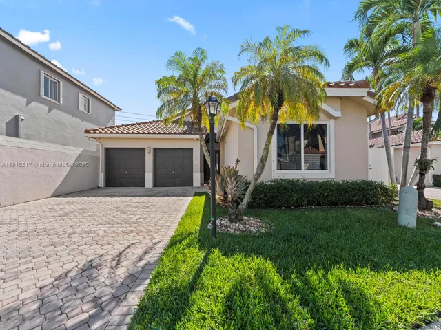 an aerial view of residential houses with outdoor space and river