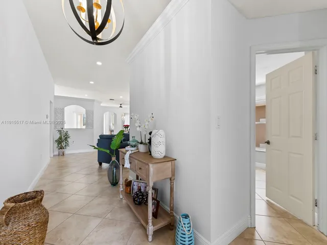 a kitchen with stainless steel appliances granite countertop a stove microwave and sink