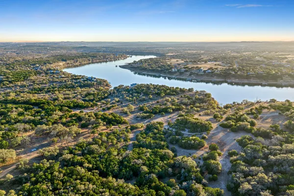 an aerial view of city and lake