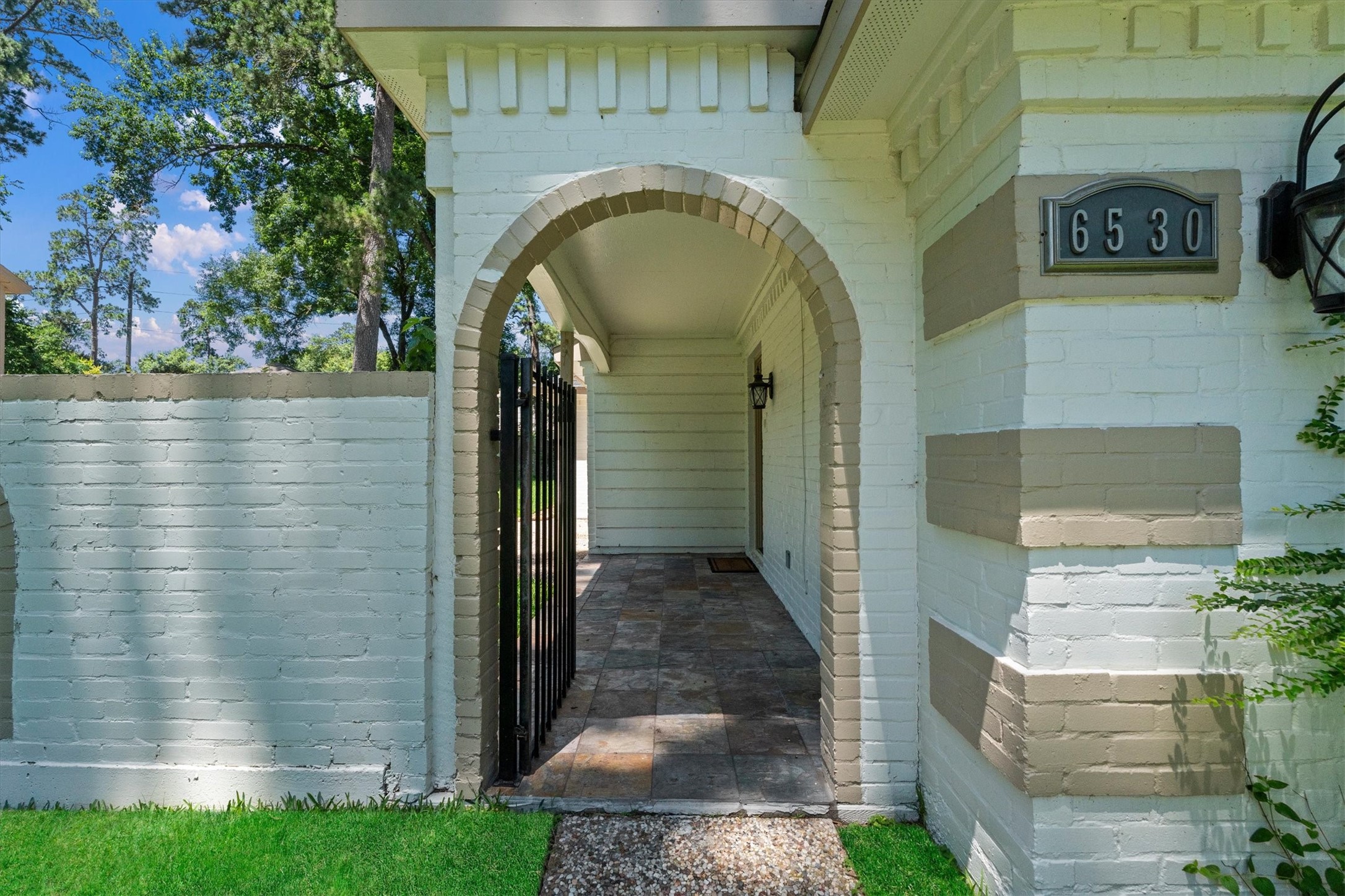 6530 Bayonne Drive Spring, TX 77389 - Photo 4 of 37 a view of entrance gate of a house with yard and parking