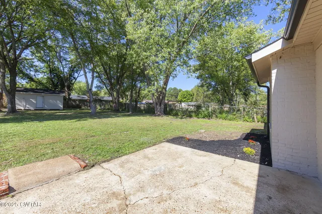 a view of a backyard with green space