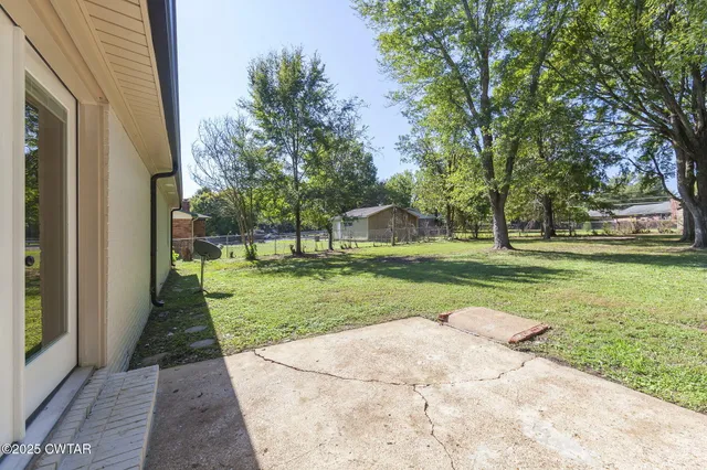 a view of a park with large trees