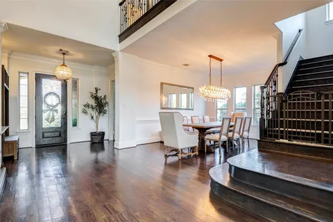a view of a livingroom with furniture and hardwood floor