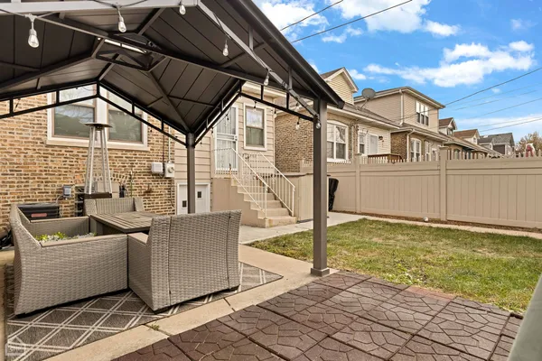 a view of a terrace with couches and sky view