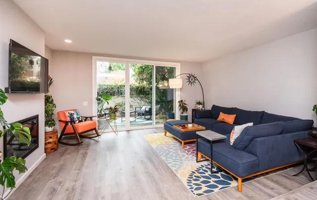 a living room with furniture and a table
