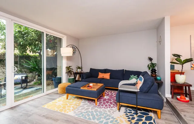 a building outdoor space with patio furniture and potted plants