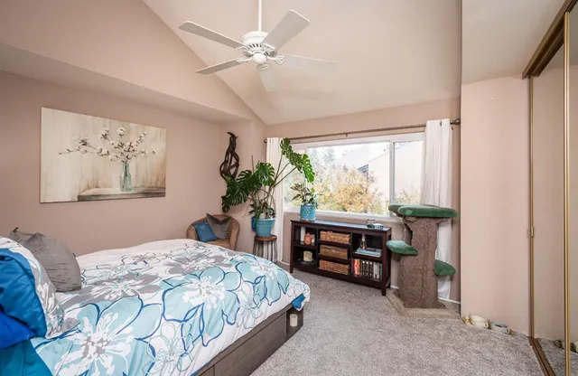 a bathroom with a sink a toilet and shower curtain