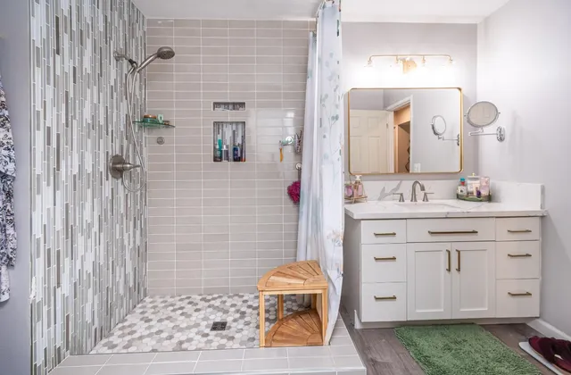 a living room with furniture and a potted plant