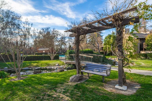 a view of a lake with houses in back